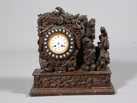 AN UNUSUAL CARVED OAK MANTEL CLOCK, 19TH CENTURY, boldly carved with foliage,...