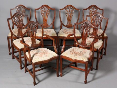 A SET OF EIGHT SHIELD-BACK MAHOGANY DINING CHAIRS, including a pair of...