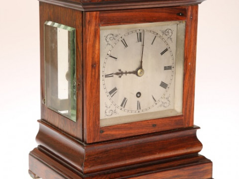 A ROSEWOOD MANTEL CLOCK, CIRCA 1850, with top and side bevelled viewing...