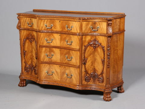 A HANDSOME CHIPPENDALE STYLE MAHOGANY SIDEBOARD, of serpentine outline,...