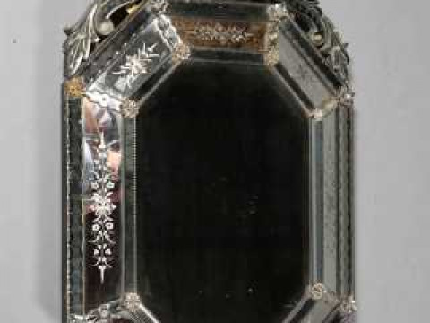 A VENETIAN WALL MIRROR, LATE 19TH CENTURY, the scrolling surmount above...