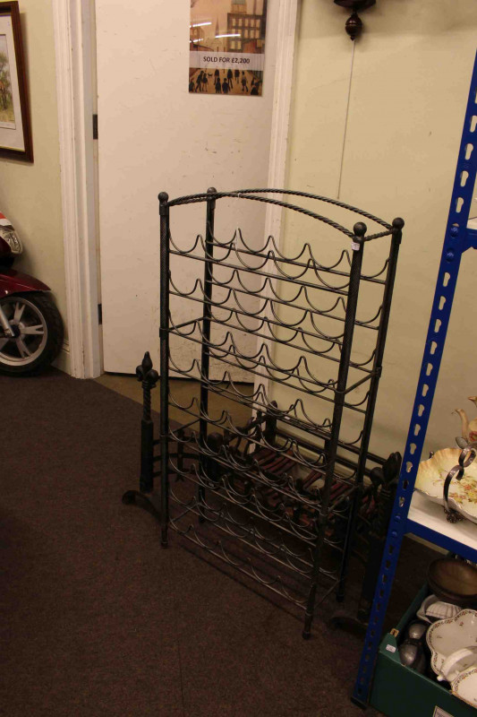 Portcullis style dog grate and wrought metal forty five bottle wine rack (2)