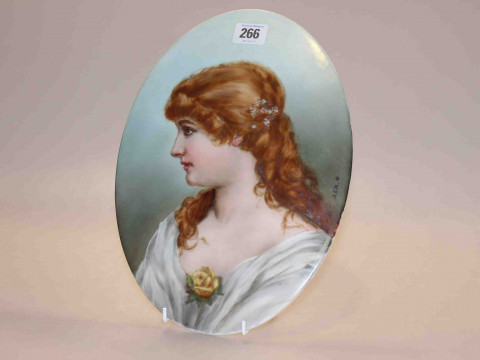 KPM porcelain oval plaque, painted with a portrait of a young lady, signed...