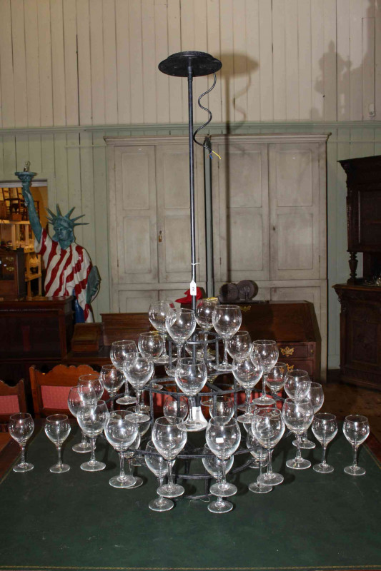 Chandelier style cast iron wine glass holder, holding forty glasses over five tiers