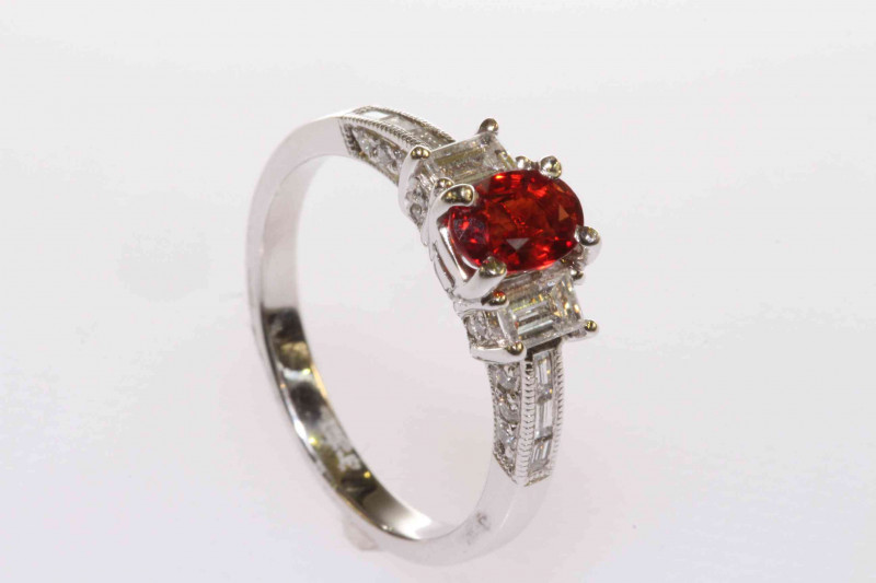 18 carat gold, orange oval sapphire and baguette diamond shoulder ring, size L
