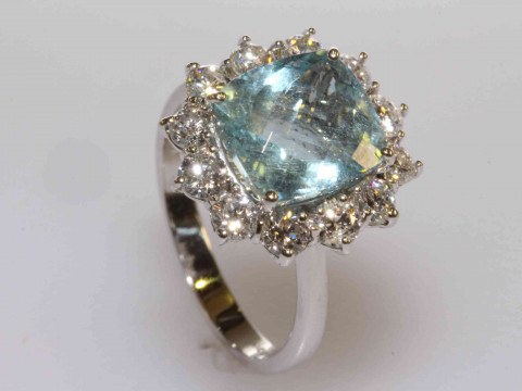 18 carat gold, cushion shaped aquamarine and round brilliant cut diamond...
