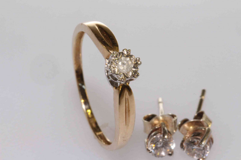 9 carat gold and diamond ring, size N½; and a pair of earrings