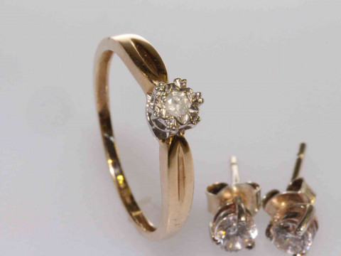 9 carat gold and diamond ring, size N½; and a pair of earrings