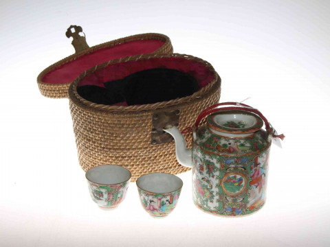 Cantonese Famille Rose teapot and pair of tea bowls in fitted wicker case