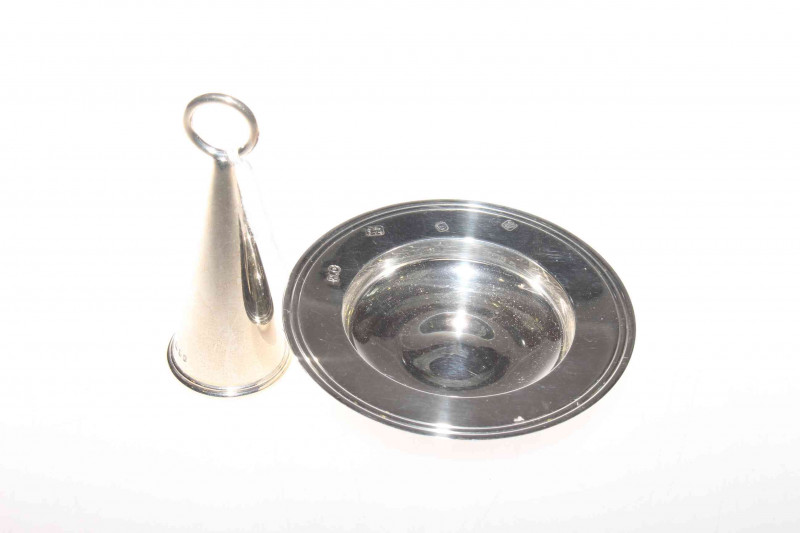 Silver candle snuffer and a silver 'alms' dish (2)