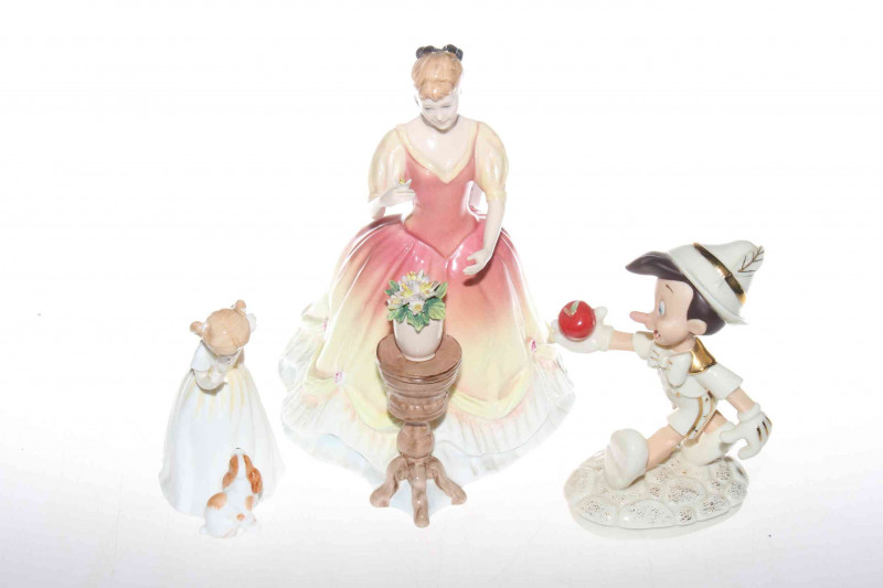 Royal Doulton figure, Sarah; Pinocchio figure and a Royal Doulton figure, Sit (3)