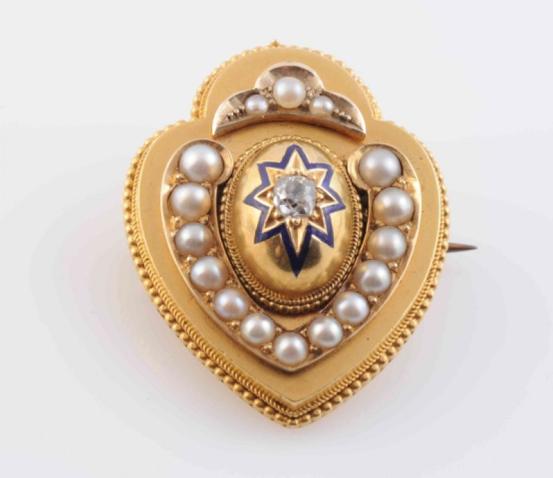A PEARL AND DIAMOND LOCKET BROOCH, CIRCA 1880-1890, the moulded heart shaped mount with subtle beaded detailing to the perimeter, set to the centre with a raised oval mount set with subtle blue enamelling in a heart shape and a single old brilliant cut di
