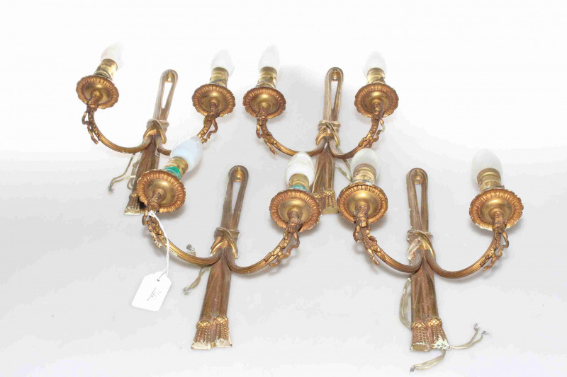 Four gilt metal two branch wall lights