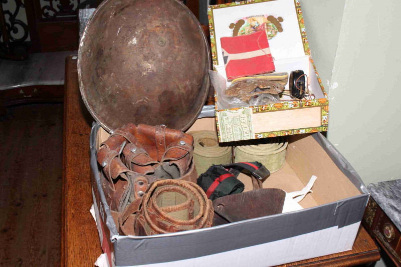Collection of militaria including helmet, bullet and other belts, badges, armband, etc