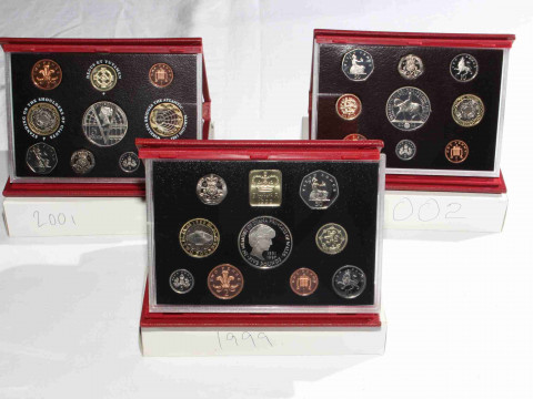 Three Royal Mint Proof coins sets, 1999, 2001 and 2002