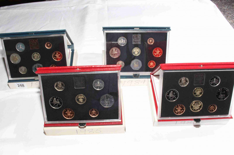 Four Royal Mint Proof coin sets, 1983, 1984, 1985 and 1986