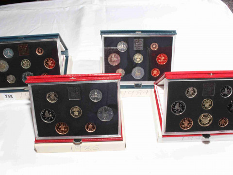 Four Royal Mint Proof coin sets, 1983, 1984, 1985 and 1986