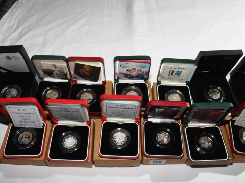 Thirteen Royal Mint 50 pence silver proof coins