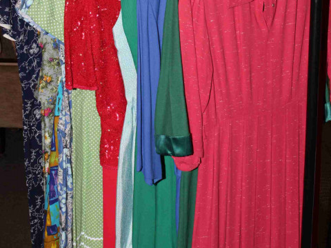 Twelve vintage dresses in various materials