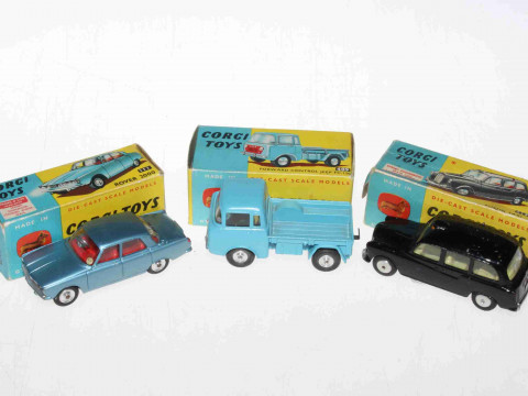 Three Corgi models, Rover 2000 252, Austin Taxi 418 and Forward Control...
