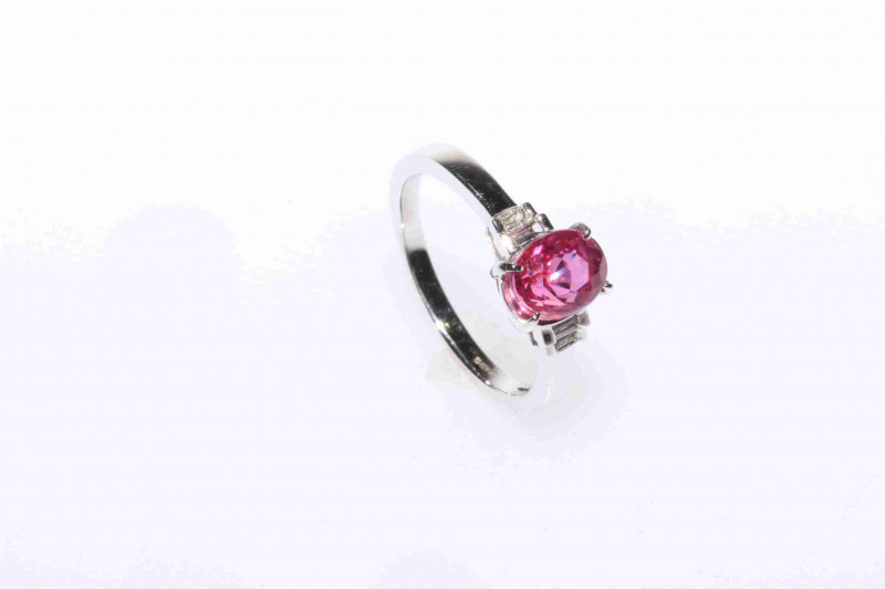 18 carat white gold, oval pink sapphire and baguette diamond ring, size J½