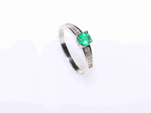 Platinum, round emerald and channel set baguette diamond ring, size M