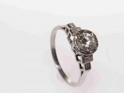 Vintage 1950's platinum, round brilliant diamond ring with baguette diamond...