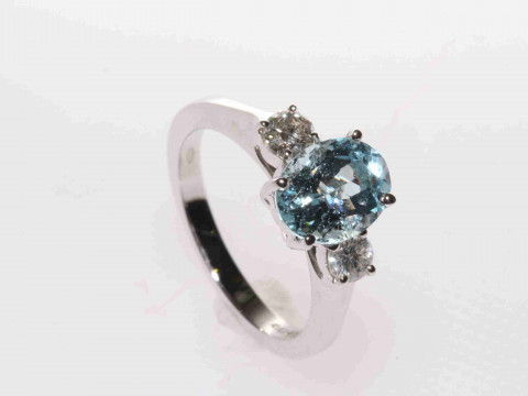 18 carat gold, aquamarine and round brilliant diamond three-stone ring,...