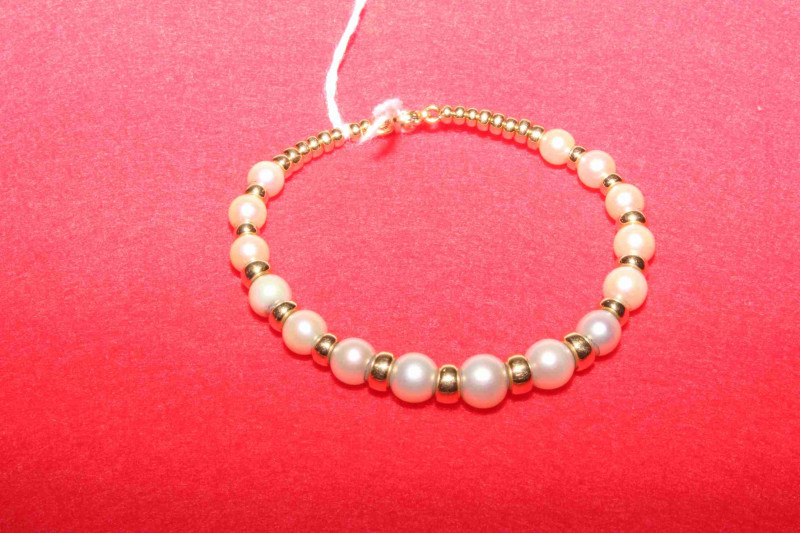 18 carat yellow gold and South Sea pearl bangle