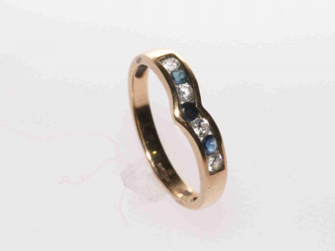 9 carat yellow gold V-shaped channel set sapphire and cubic zirconia ring,...