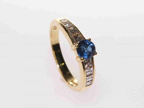 18 carat yellow gold, round sapphire and channel set princess cut diamond...