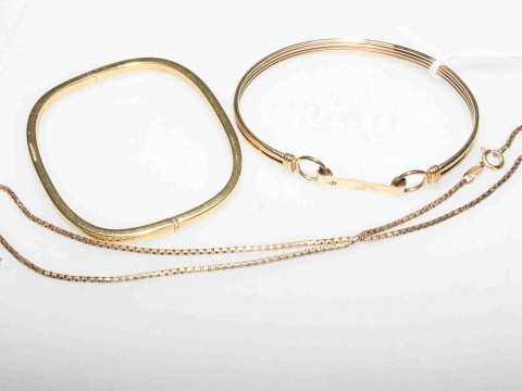 18 carat gold hinged bangle, 10.5 grams; 9 carat gold bangle, 10.2 grams;...