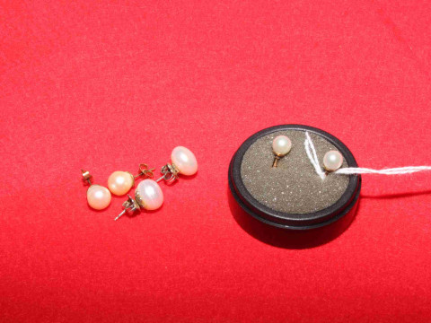 Three pairs of cultured pearl earrings