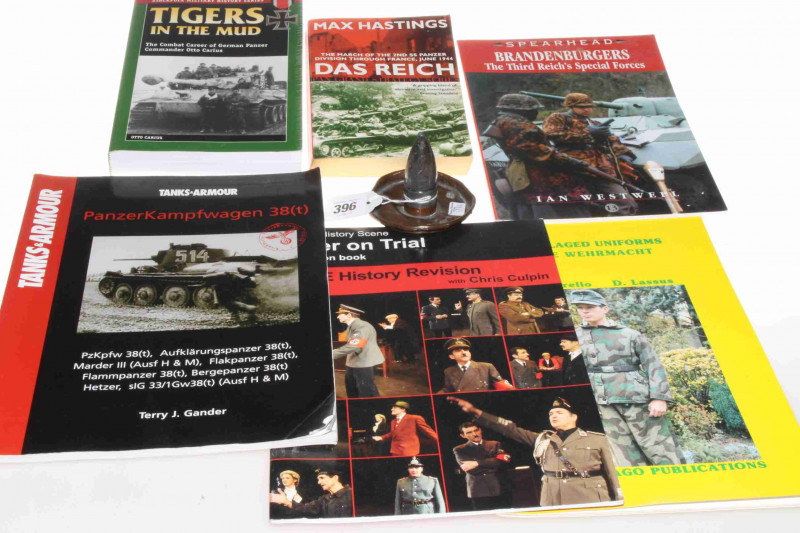 Collection of WWII German military books and trench art shell
