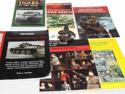 Collection of WWII German military books and trench art shell