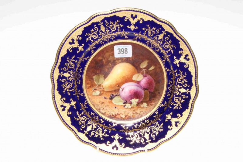 Coalport plate painted with fruit, signed F.H. Chivers, with gilt on blue border