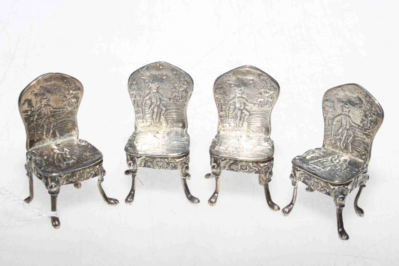 Four Continental silver patterned back dolls house chairs