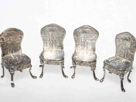Four Continental silver patterned back dolls house chairs