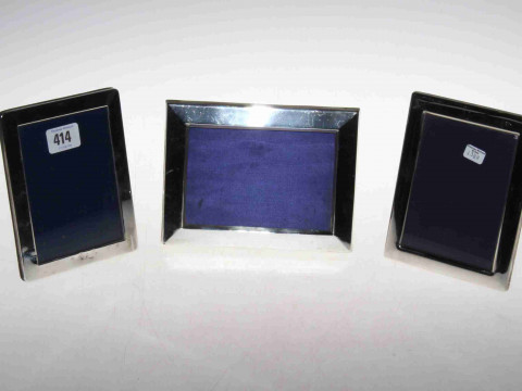 Three silver easel photograph frames