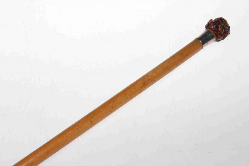 Silver mounted malacca cane with elephant carved handle