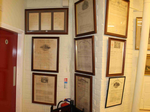 Collection of nine framed Insurance Certificates and Japanese two fold...