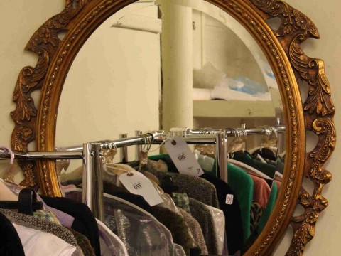 Oval gilt framed bevelled wall mirror