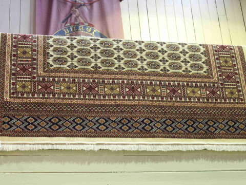 Bokhara carpet with a beige ground 2.80 by 2.00