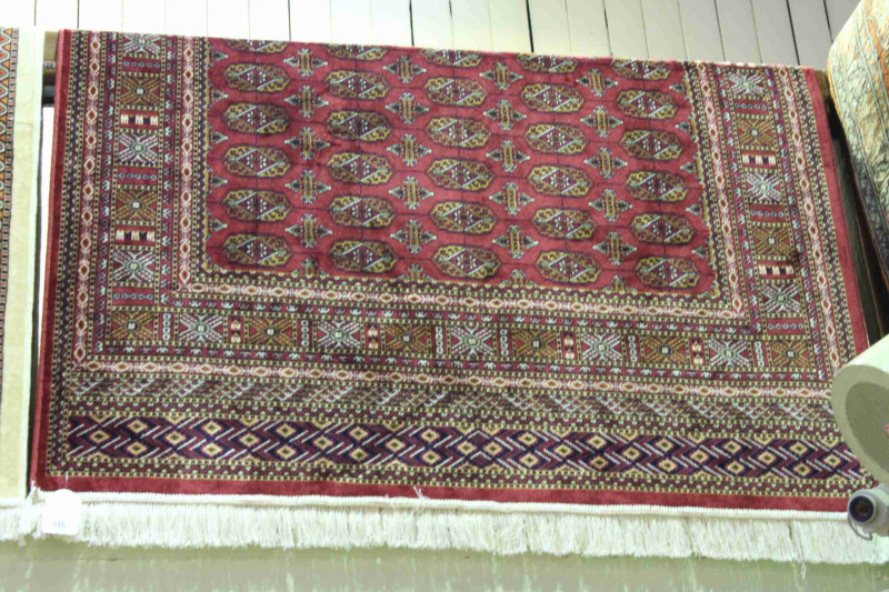 Bokhara rug with a red ground 1.90 by 1.40