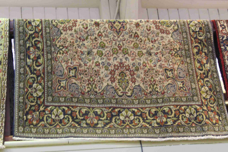 A fine Qum carpet 2.25 by 1.40