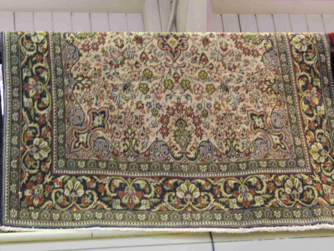 A fine Qum carpet 2.25 by 1.40