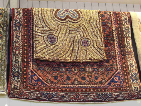 Persian design wool rug 1.90 by 1.24 and antique Hookey rug 1.17 by 0.72...