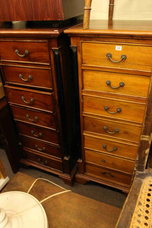Pair slim hardwood seven drawer chests with ebonised pillars