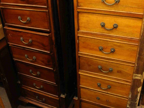 Pair slim hardwood seven drawer chests with ebonised pillars