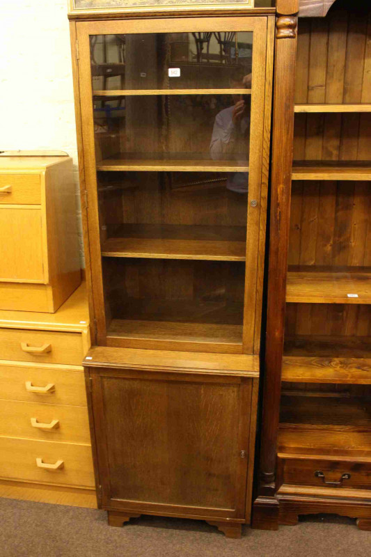 Slim oak glazed door cabinet bookcase
